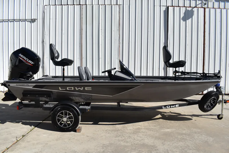 The Image of 2026 Lowe Stinger 175C fishing boat with Mercury engine, parked on trailer. - 0