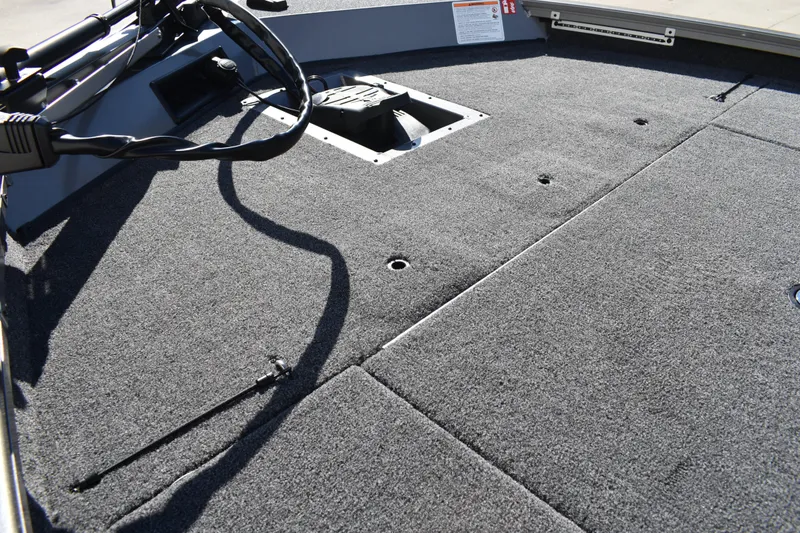 Slide: The Image of 2026 Lowe Stinger 175C boat trailer hitch and winch on concrete surface. - 12