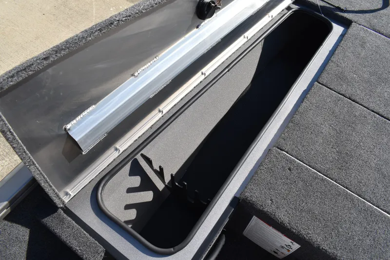 Slide: The Image of Open storage compartment in 2026 Lowe Stinger 175C boat. - 20