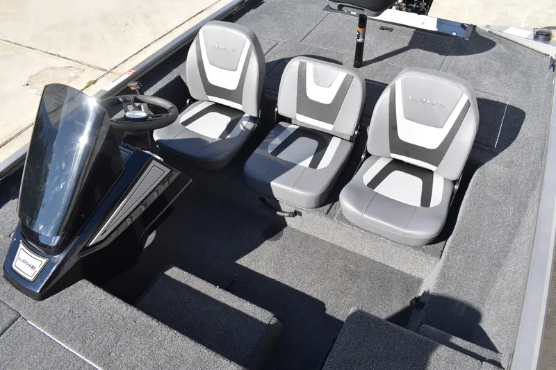 Slide: The Image of Open storage compartment in 2026 Lowe Stinger 175C boat, featuring secure latch and spacious interior. - 21