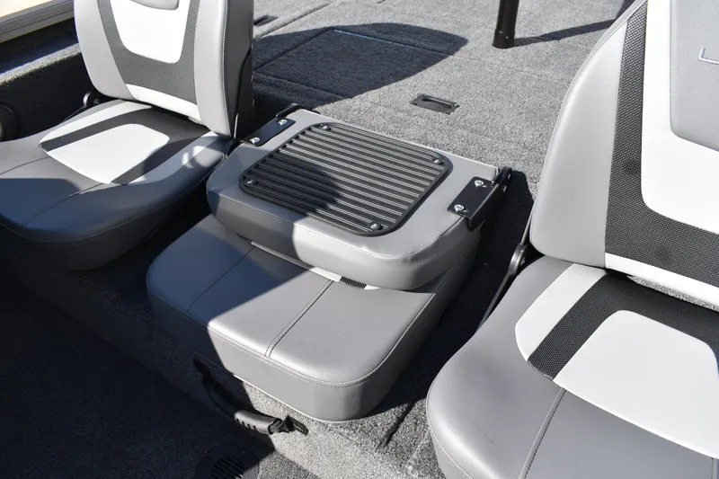 Slide: The Image of 2026 Lowe Stinger 175C boat storage compartment with open lid, showcasing interior space. - 23