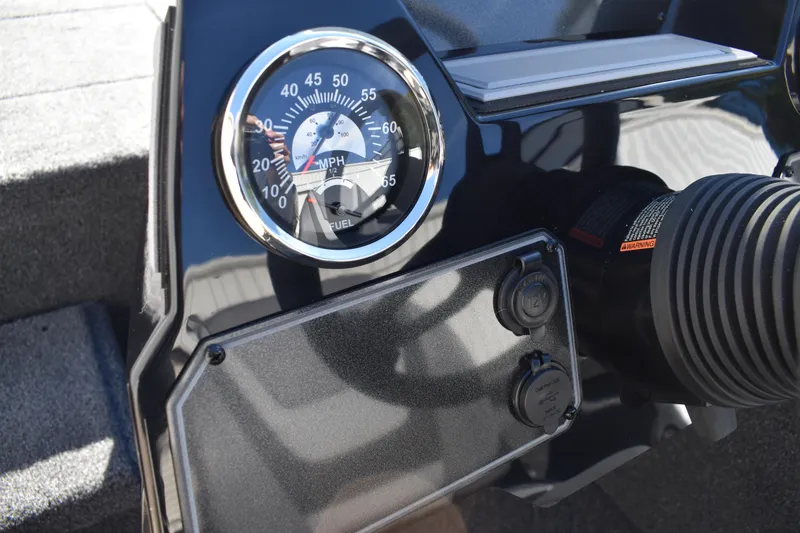 Slide: The Image of Interior of 2026 Lowe Stinger 175C boat with gray seating and carpeted surfaces. - 28