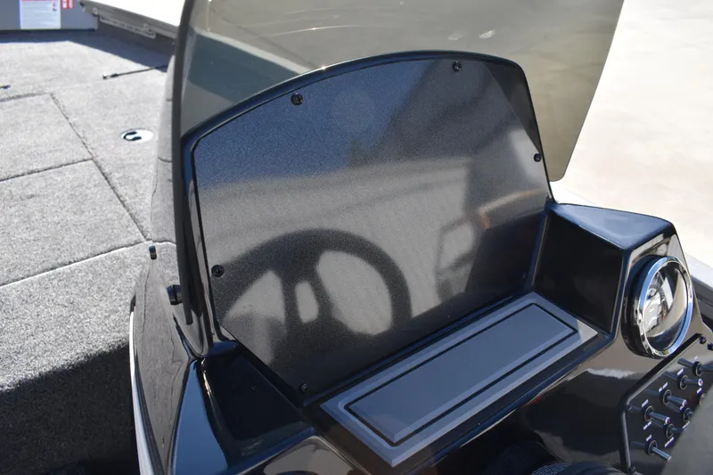 Slide: The Image of 2026 Lowe Stinger 175C boat interior with three gray seats and steering console. - 29