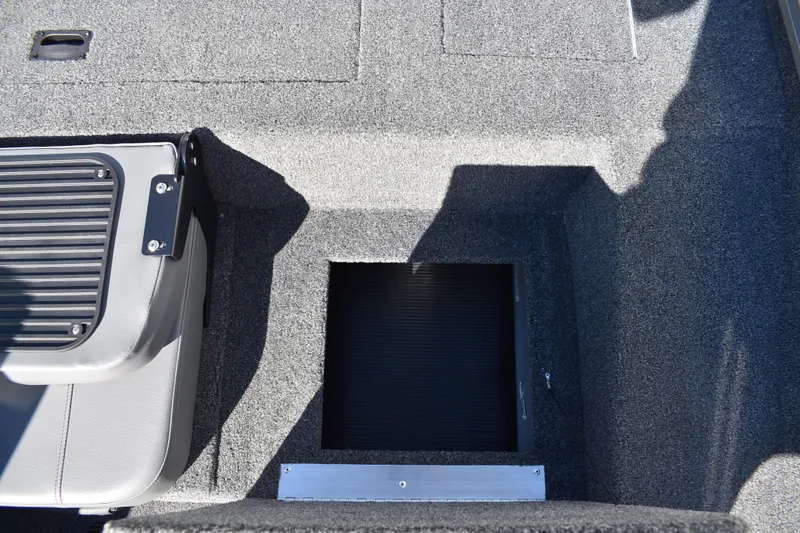 Slide: The Image of 2026 Lowe Stinger 175C boat console with steering wheel and dashboard controls. - 32