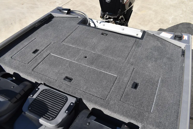 Slide: The Image of Carpeted deck of a 2026 Lowe Stinger 175C boat, showcasing sleek design. - 34