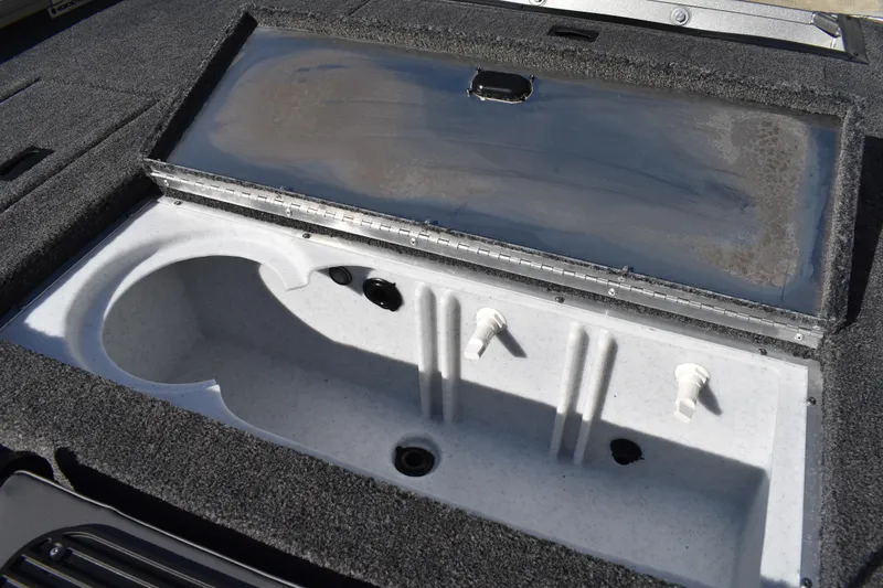 Slide: The Image of 2026 Lowe Stinger 175C boat dashboard with steering wheel shadow. - 35