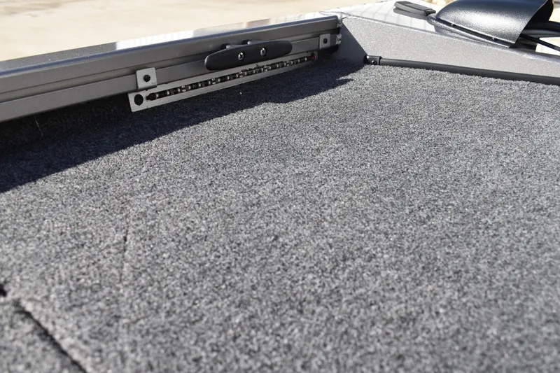 Slide: The Image of 2026 Lowe Stinger 175C boat storage compartment with open lid, showcasing interior space. - 39