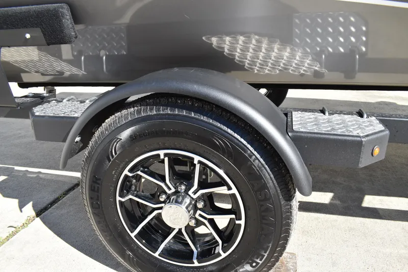 Slide: The Image of Carpeted deck of 2026 Lowe Stinger 175C boat with shadow. - 5