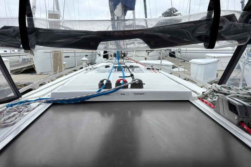 Slide: The Image of 1988 J Boats J/28 sailboat deck with rigging and marina view. - 12