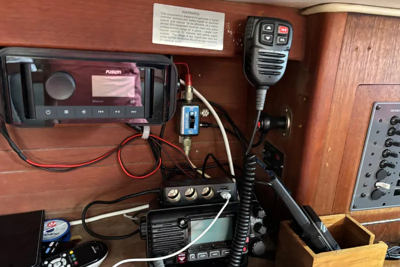 Slide: The Image of 1988 J Boats J/28 interior electronics panel with radio and control systems. - 26