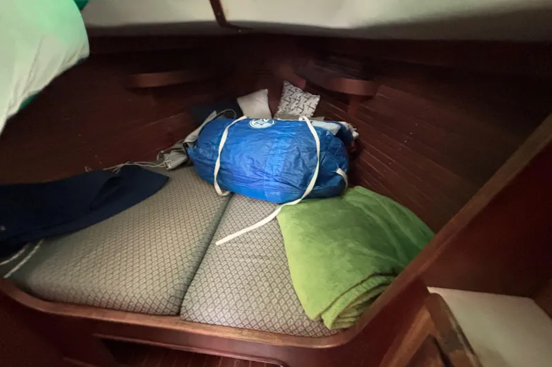 Slide: The Image of Cozy cabin interior of 1988 J Boats J/28 with bedding and gear. - 30