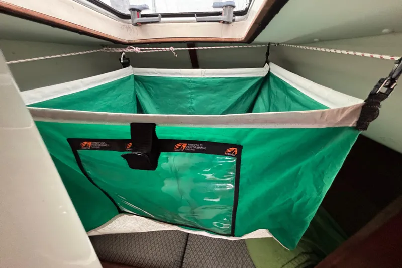 Slide: The Image of Green storage hammock inside 1988 J Boats J/28 sailboat cabin. - 31