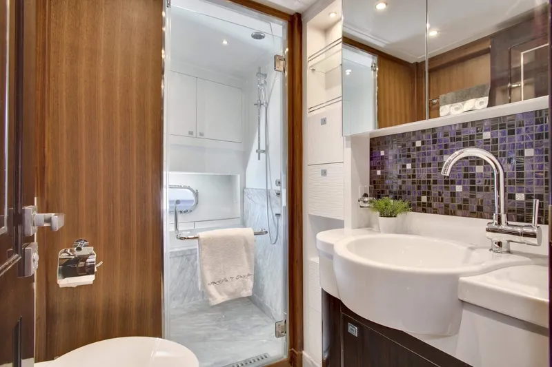 Slide: The Image of Luxurious bathroom in 2026 Selene 92 Ocean Explorer yacht, featuring modern fixtures and elegant design. - 13