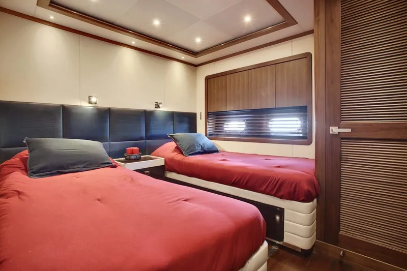 Slide: The Image of Luxurious twin bedroom in 2026 Selene 92 Ocean Explorer yacht, featuring elegant design and cozy ambiance. - 14