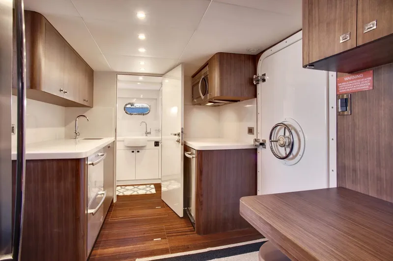 Slide: The Image of Luxurious interior of 2026 Selene 92 Ocean Explorer yacht with modern kitchen design. - 19