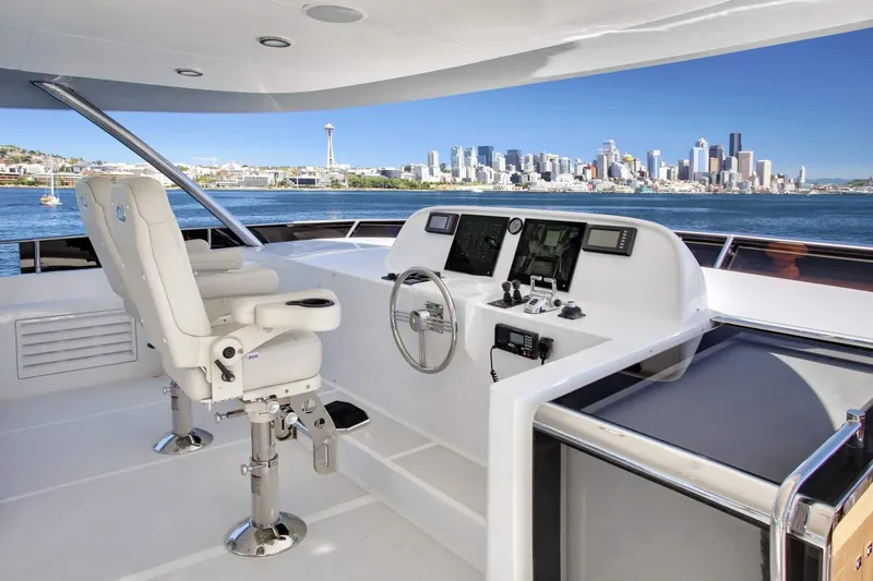 Slide: The Image of Helm of 2026 Selene 92 Ocean Explorer yacht with city skyline view. - 21