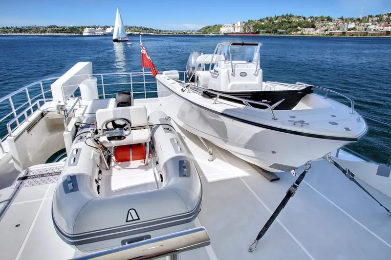 Slide: The Image of Luxury yacht Selene 92 Ocean Explorer 2026 with tenders on deck, sailing in scenic waters. - 22