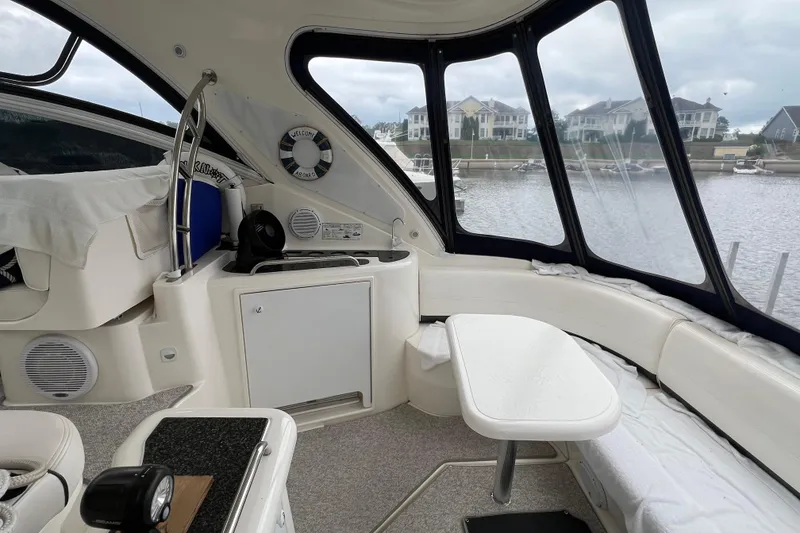 Slide: The Image of Interior of 2005 Cruisers Yachts 400 Express with seating and waterfront view. - 12