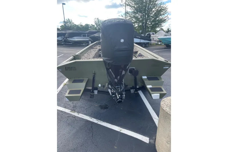 Slide: The Image of 2024 Crestliner 1870 Retriever FCC boat, rear view in parking lot. - 2