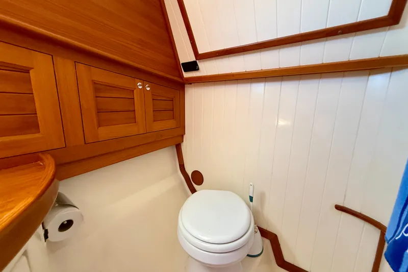 Slide: The Image of Luxurious wooden bathroom interior of 2002 Palm Beach Motor Yachts Avalon 38. - 10