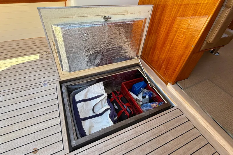 Slide: The Image of Storage compartment on 2002 Palm Beach Motor Yachts Avalon 38, featuring organized gear and equipment. - 15