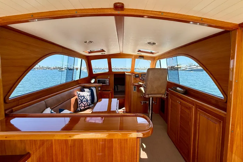 Slide: The Image of Luxurious interior of 2002 Palm Beach Motor Yachts Avalon 38 with wooden finish and waterfront view. - 16