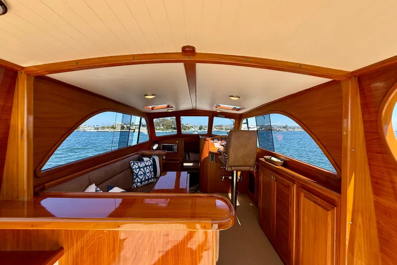 Slide: The Image of Luxurious interior of 2002 Palm Beach Motor Yachts Avalon 38 with wooden finish and scenic view. - 23
