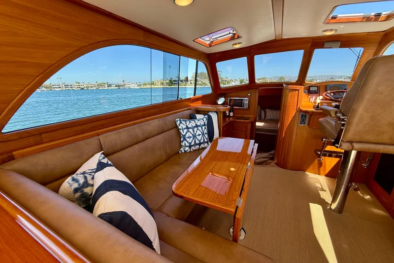 Slide: The Image of Luxurious interior of 2002 Palm Beach Motor Yachts Avalon 38 with elegant wood finish. - 26
