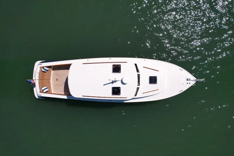 Slide: The Image of Overhead view of 2002 Palm Beach Motor Yachts Avalon 38 on calm water. - 3