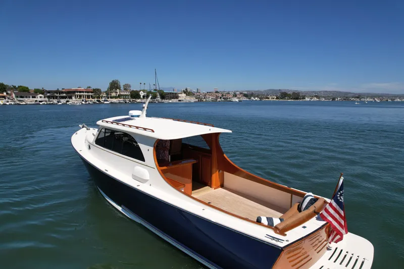 Slide: The Image of 2002 Palm Beach Motor Yachts Avalon 38 cruising on a sunny day in a marina. - 4