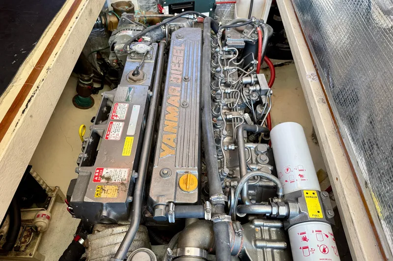 Slide: The Image of Engine compartment of 2002 Palm Beach Motor Yachts Avalon 38 with Yanmar diesel engine. - 44