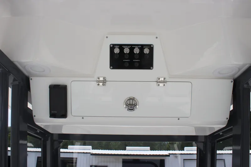 Slide: The Image of Interior view of 2026 Sea Fox 248 Commander boat's control panel and storage compartment. - 10