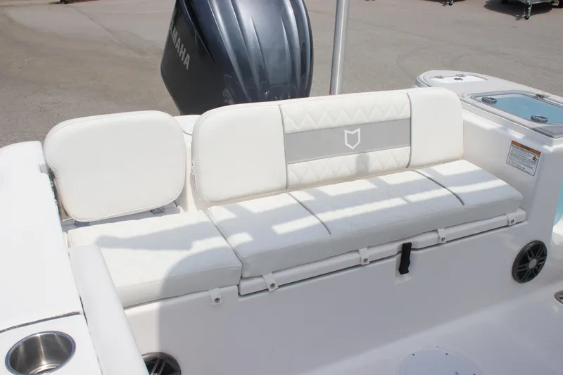 Slide: The Image of 2026 Sea Fox 248 Commander boat with white cushioned seating and Yamaha engine. - 21