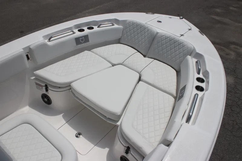 Slide: The Image of 2026 Sea Fox 248 Commander boat with luxurious white seating and cup holders. - 23