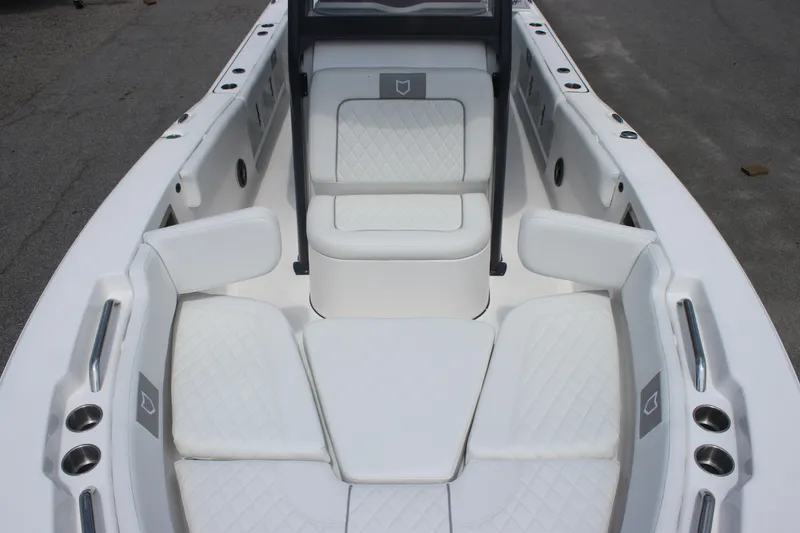 Slide: The Image of 2026 Sea Fox 248 Commander boat interior with white cushioned seating and cup holders. - 27