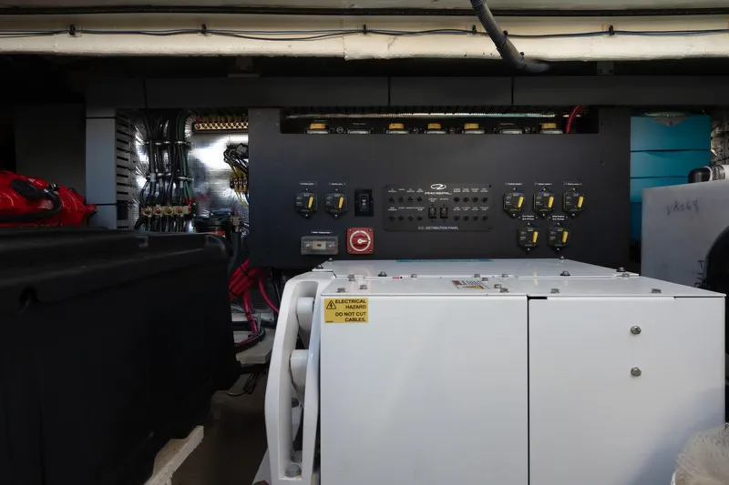 Slide: The Image of Engine room of 2022 Regal 36 XO boat with control panel and wiring. - 32