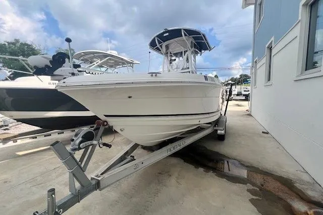The Image of 2017 Robalo R200 Center Console boat on trailer, parked outdoors. - 0