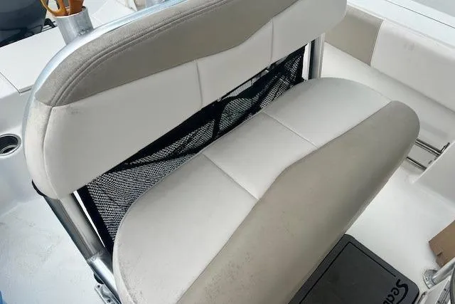 Slide: The Image of 2017 Robalo R200 Center Console boat seat with storage net. - 10