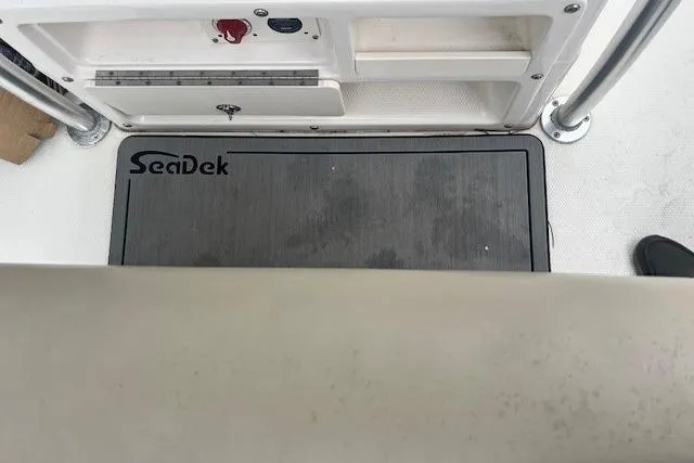 Slide: The Image of 2017 Robalo R200 Center Console boat with SeaDek flooring, interior view. - 11