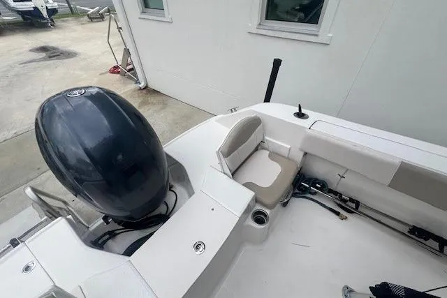 Slide: The Image of 2017 Robalo R200 Center Console boat with outboard motor and seating area. - 12