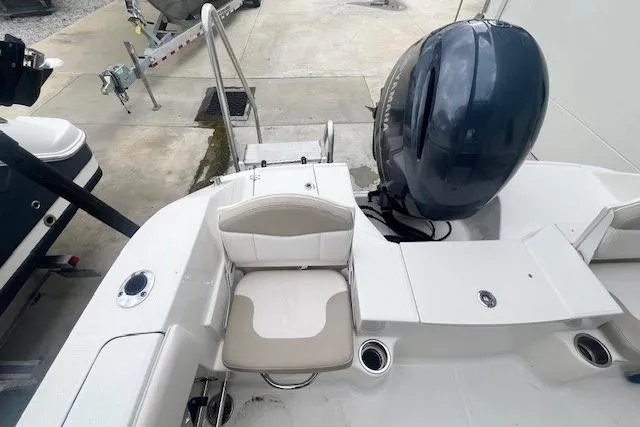 Slide: The Image of 2017 Robalo R200 Center Console boat with outboard motor and seating area. - 13