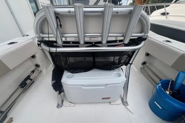 Slide: The Image of 2017 Robalo R200 Center Console boat interior with rod holders and storage. - 17