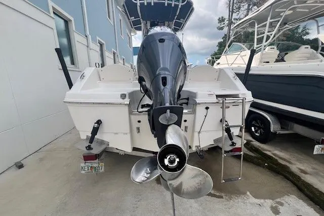 Slide: The Image of 2017 Robalo R200 Center Console boat, rear view with outboard motor and propeller. - 2
