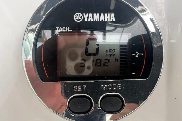 Slide: The Image of Yamaha tachometer display on 2017 Robalo R200 Center Console boat, showing 318.2 hours. - 3
