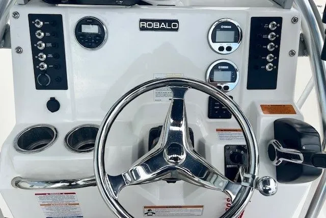 Slide: The Image of 2017 Robalo R200 Center Console dashboard with steering wheel and control panels. - 9