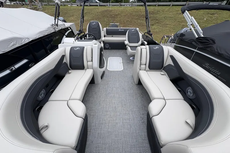 Slide: The Image of 2026 Barletta C22UC pontoon boat interior with luxurious seating and modern design. - 10