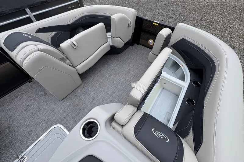Slide: The Image of 2026 Barletta C22UC pontoon boat interior with luxurious seating and storage compartments. - 11