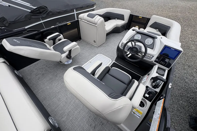 Slide: The Image of 2026 Barletta C22UC pontoon boat interior with modern helm and seating. - 15