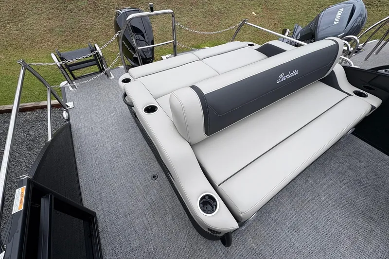 Slide: The Image of 2026 Barletta C22UC pontoon boat with luxurious seating and Yamaha outboard motor. - 16