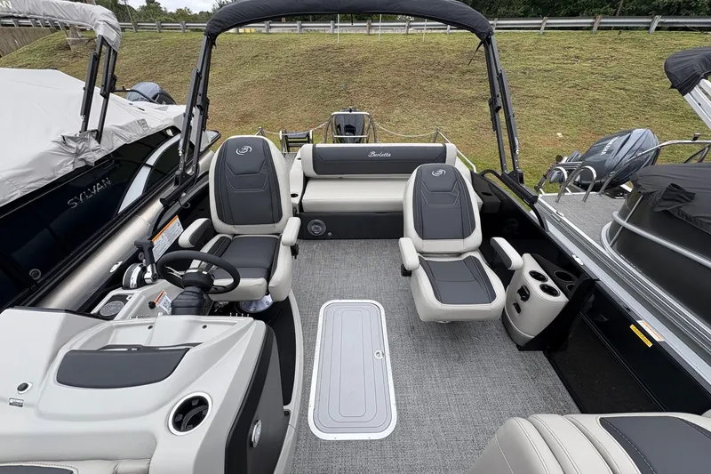 Slide: The Image of 2026 Barletta C22UC pontoon boat interior with plush seating and modern helm. - 9